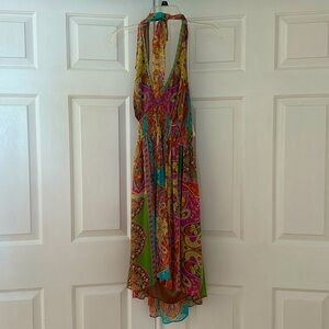 Beautiful multi color flowy backless dress perfect for the summer.